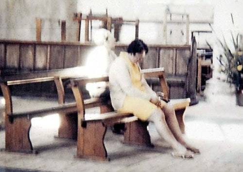While visiting Worstead Church in 1975, Peter Berthelot took a photo of his wife, Diane, which appears to show the ghost of The White Lady behind her.